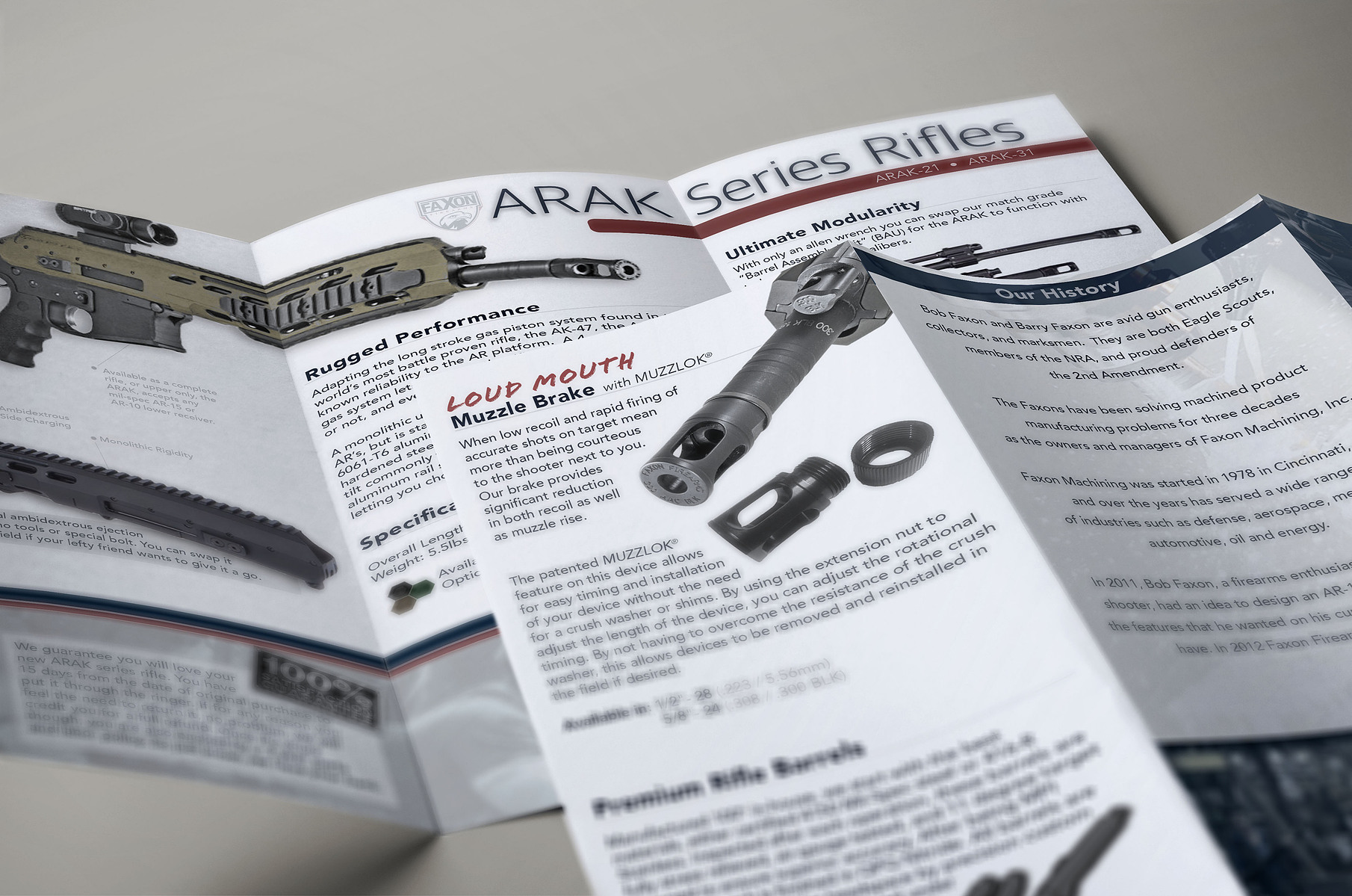 Close-up of ARAK rifle product literature and a second technical product sheet on a light surface.